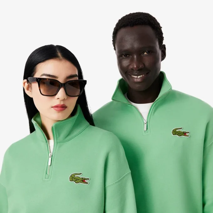 Unisex-Sweatshirt mit halbem Reißverschluss, lockerer Passform und Emblem-Akzent